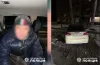 водій