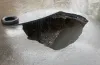 провалився асфальт на Богомаза