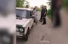 водій